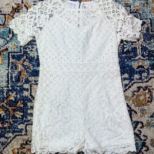 White/off white Women’s lace romper. Never worn.